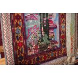 An approx. 4'5" x 2'10" pictorial Bolochi rug