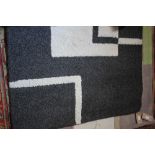 An approx. 5'8" x 4' wool rug