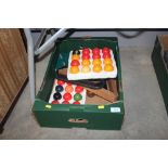 A box containing various pool balls; snooker balls