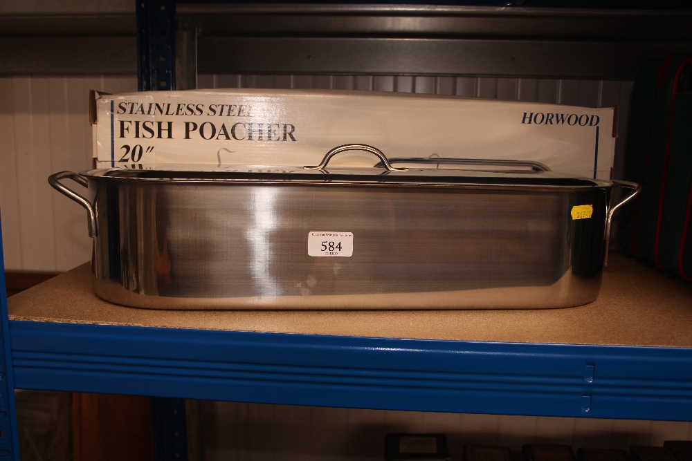 A stainless steel fish poacher with original box