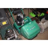 A Qualcast petrol cylinder mower