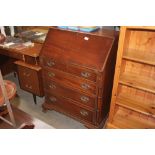 A bureau fitted four drawers