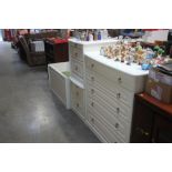 A bedroom suite comprising of five drawer chest, a