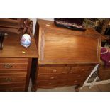 A carved hardwood bureau fitted two short over two