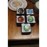 Five boxed glass paper-weights