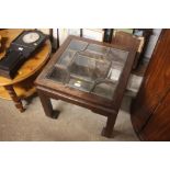 An oriental style and glass top table