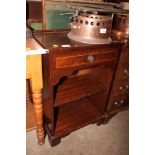 A reproduction mahogany bookcase fitted single dra