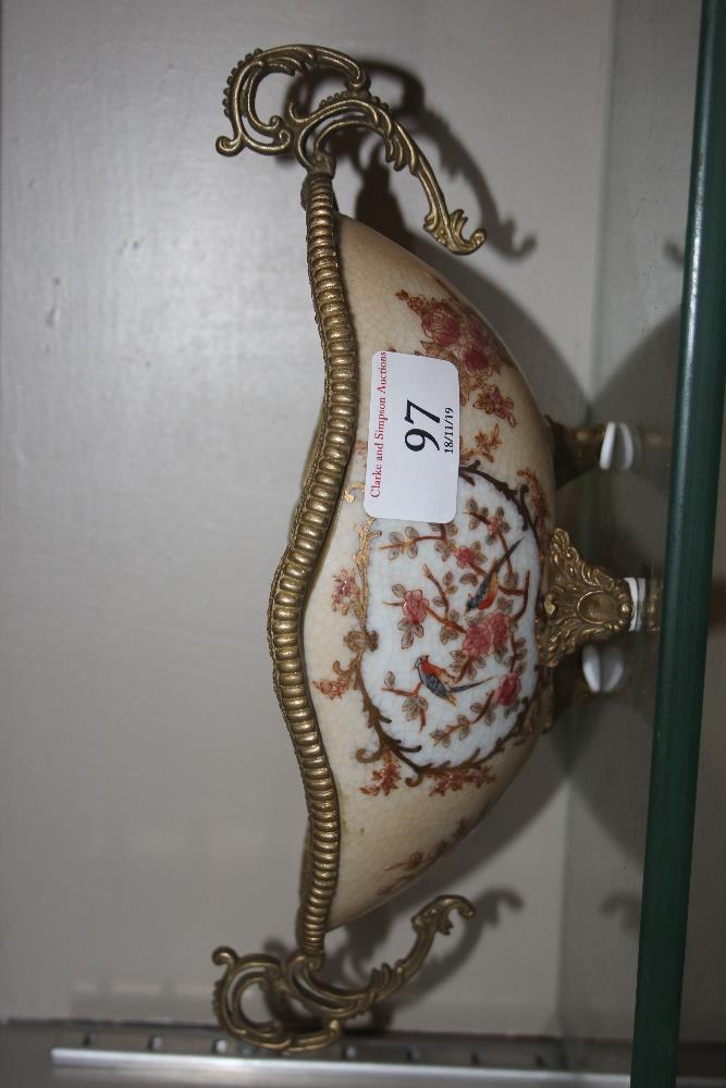 An EP China floral decorated and gilt metal mounte