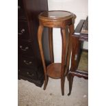 A mahogany two tier plant stand