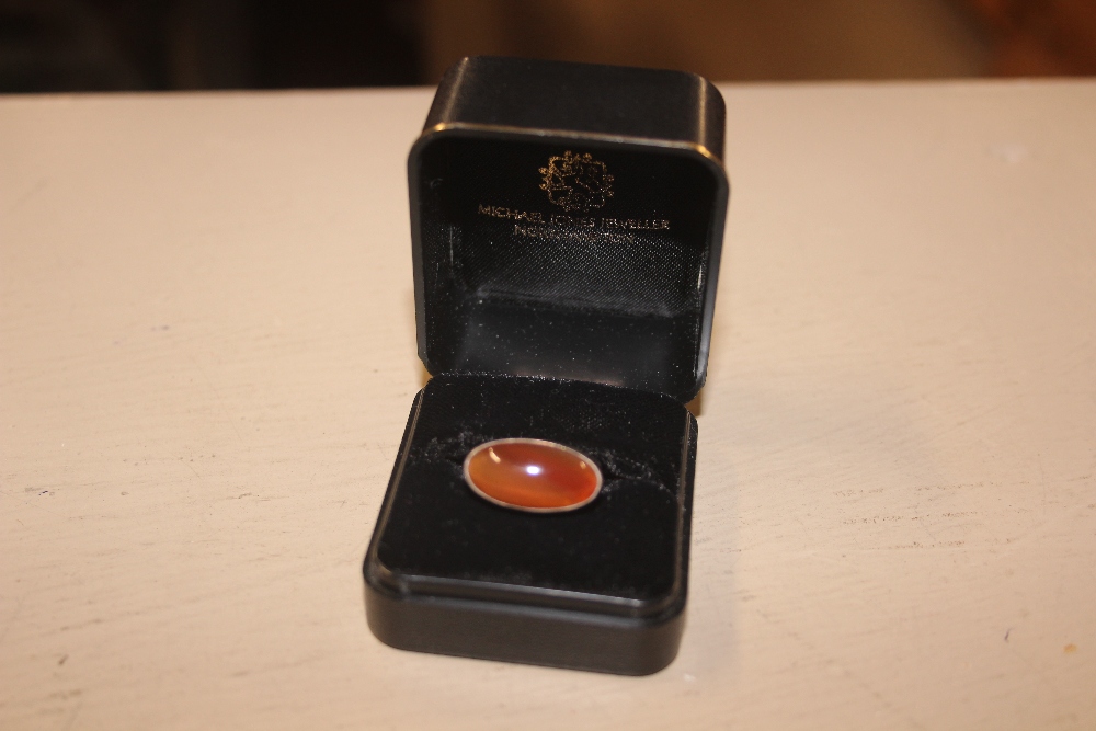 A silver and amber set ring