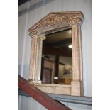 A continental style mirror flanked by columns
