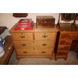 A light oak chest fitted two short over two long d