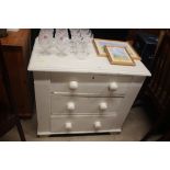 A white painted three drawer chest