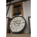 A large modern wall clock and a pine framed oblong