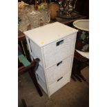 A white painted and wicker three drawer chest