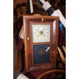 A 19th century American two hole wall clock