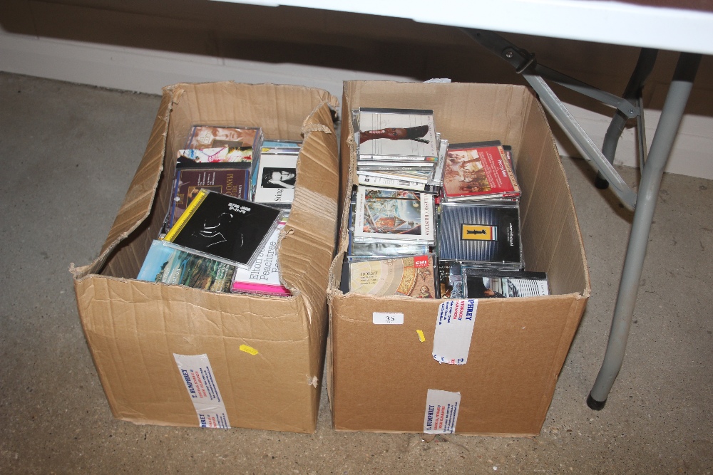 Two boxes of CDs