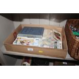 A box of miscellaneous items to include post-cards