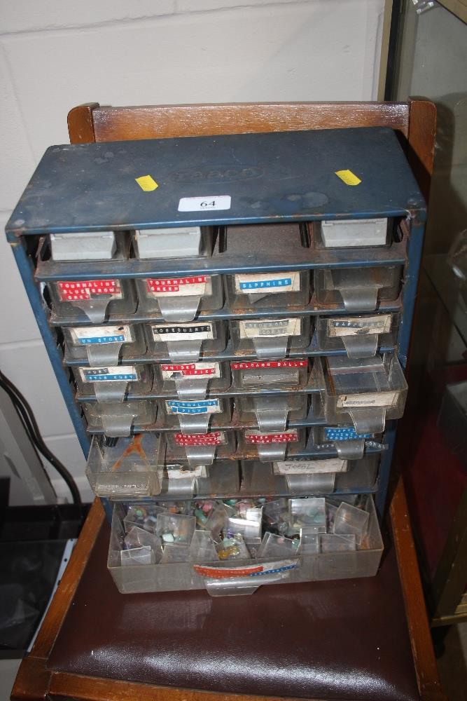 A metal and plastic chest containing various semi-