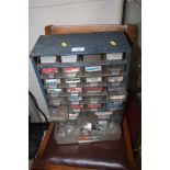 A metal and plastic chest containing various semi-