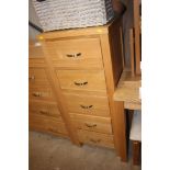 An ash five drawer chest of narrow proportions