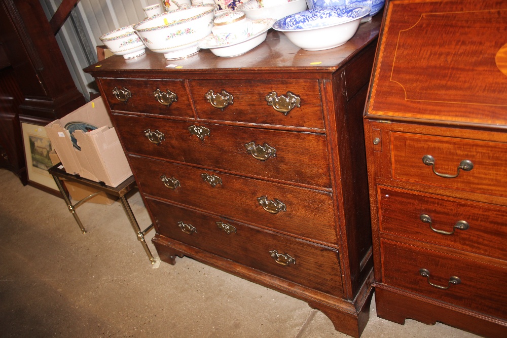 An 18th Century oak chest fitted two short over th