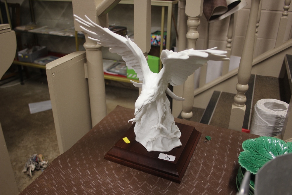 A large kaiser white glazed model of an eagle on w