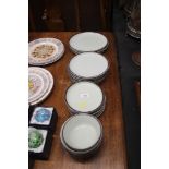 A quantity of Denby stoneware dinner plates and bo