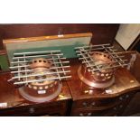 A pair of copper burners