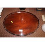 A mahogany oval tray