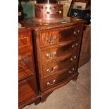 A reproduction mahogany serpentine front chest fit