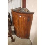 A Georgian mahogany hanging corner cupboard