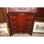 A reproduction mahogany serpentine front chest, fi