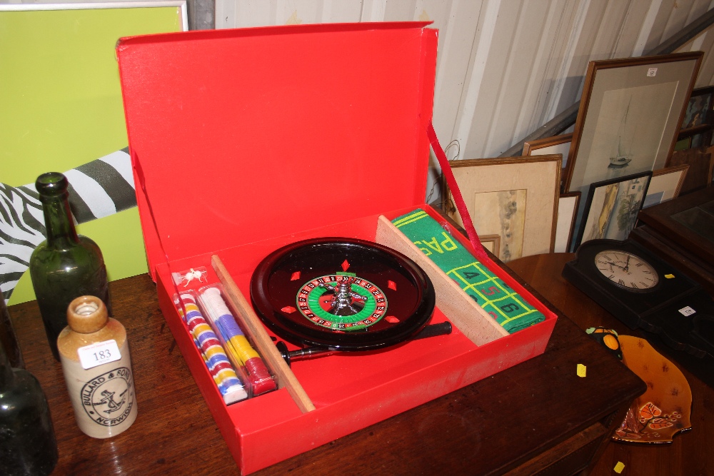 A Monte Carlo roulette wheel, in original box