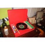 A Monte Carlo roulette wheel, in original box