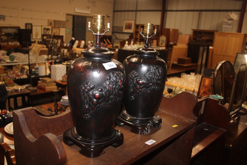 A pair of oriental bronze table lamps