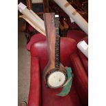 A banjo with leather carrying case