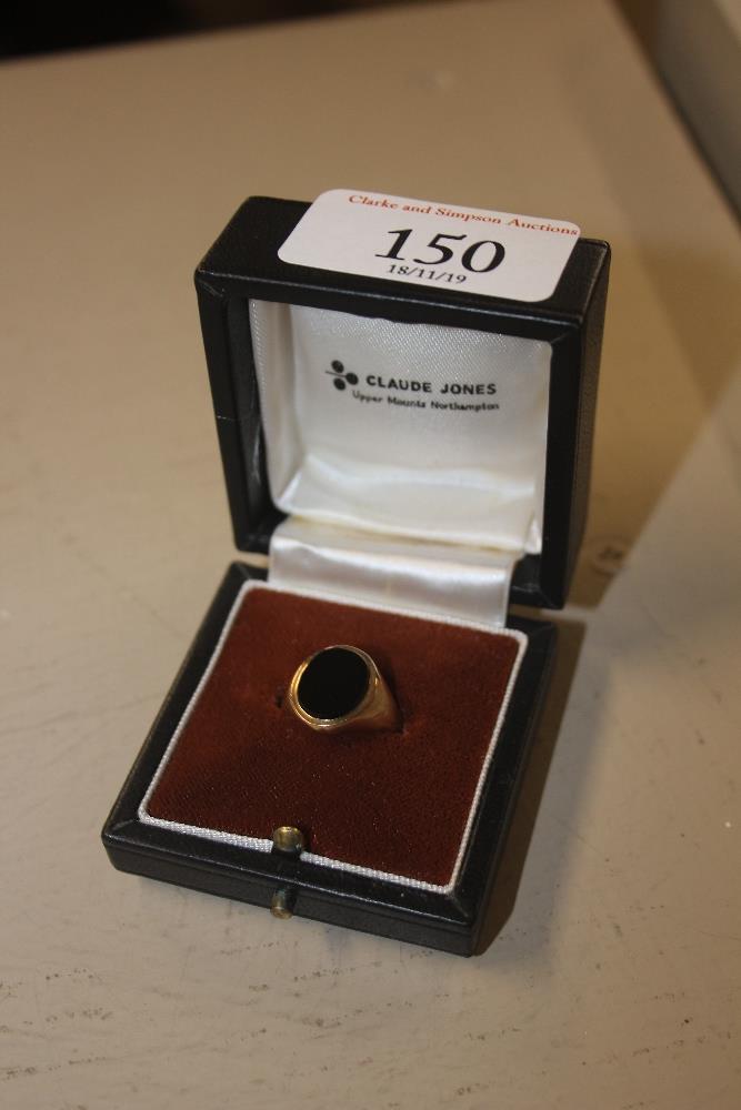 A 9ct gold onyx signet ring