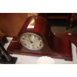 A three hole mantel clock