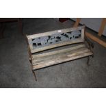 A wood and metal garden bench decorated with Afric