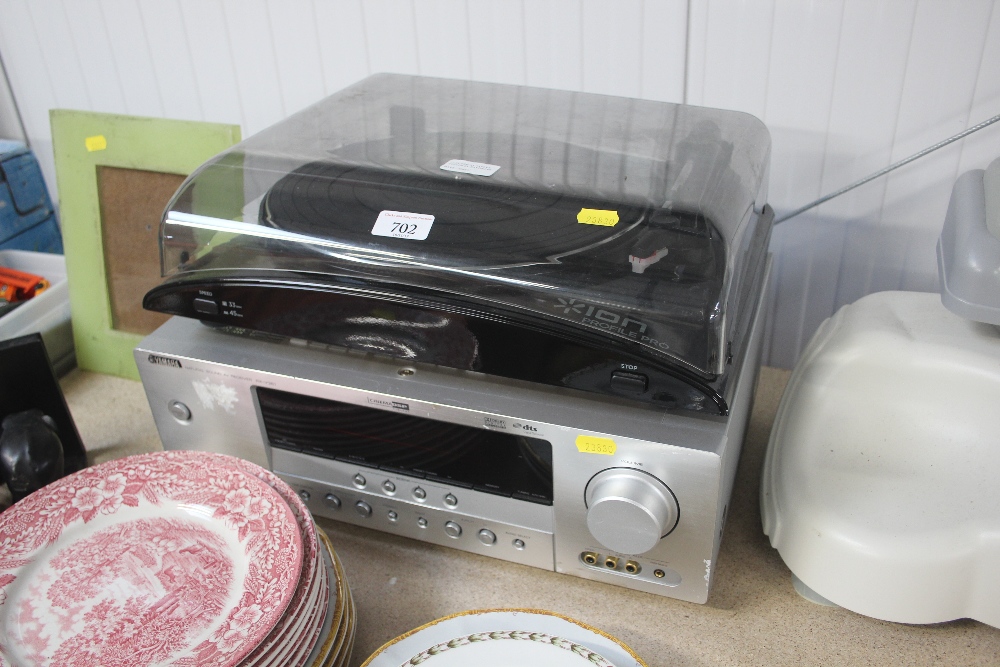 An Ion turntable together with a Yamaha amp