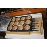 A knife set contained in a chopping board together