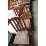 A pair of oak slat back dining chairs and one othe