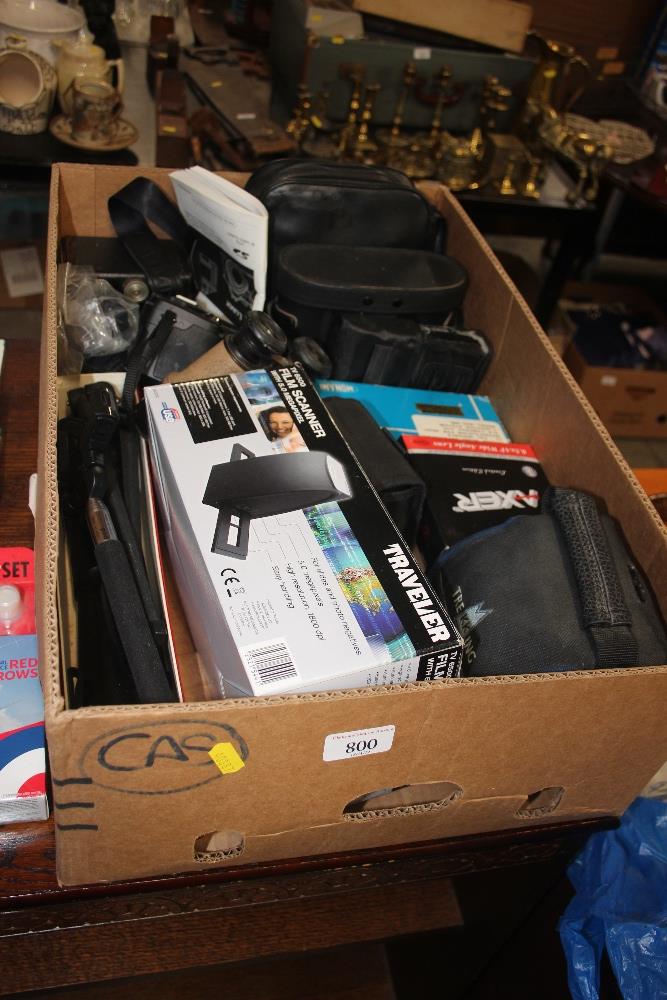 A box of various cameras and accessories, binocula