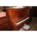 A mahogany upright piano