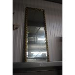 A bevelled edge oblong wall mirror