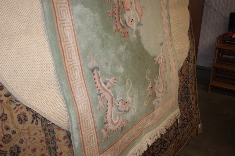 An approx. 6ft 6ins x 4ft Chinese wool rug