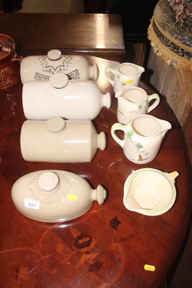A quantity of Royal Doulton jugs decorated with ph