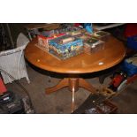 A beech circular topped table