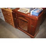 A reproduction mahogany stereo cabinet